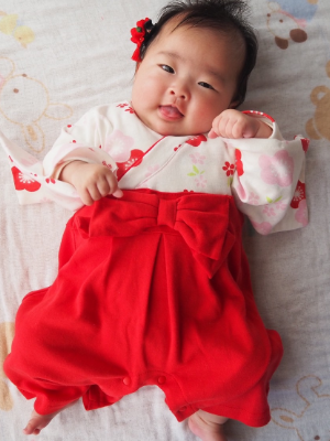 cute baby wearing red and white
